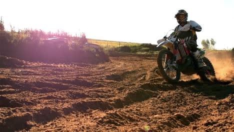 man riding a motor cross bike