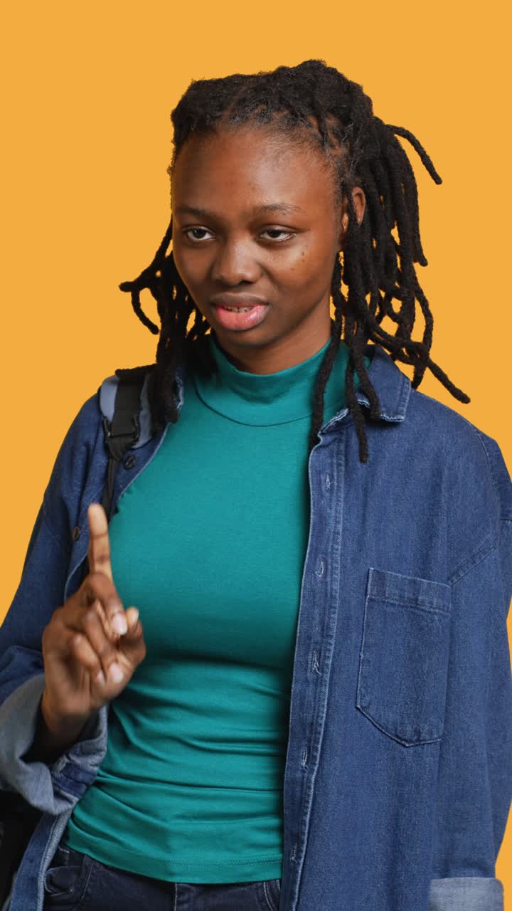 Serious African American Woman Shaking Finger to Say No