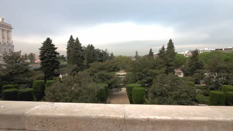 travelling forward through a gate in jardines de sabatini in the palacio real area in madrid