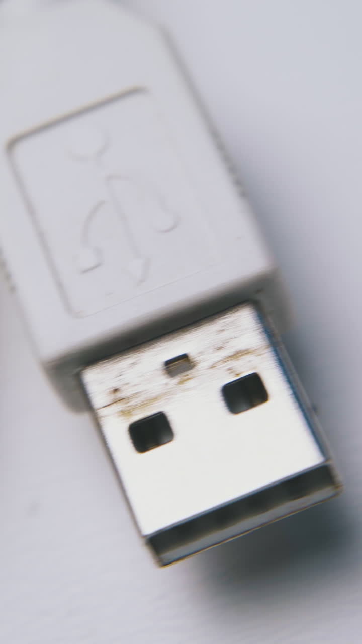 old white micro and mini usb splitter cable lies on clean light background extreme close view