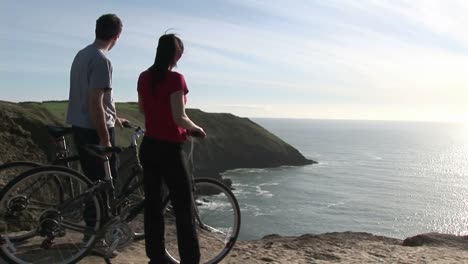 two people looking at cliff