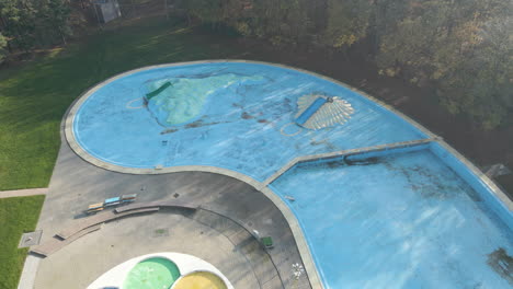 low aerial of deserted outdoor swimming pool