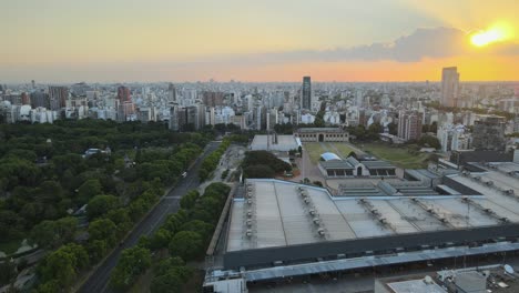 buenos aires drone view orbiting la rural exposition centre urban skyline cityscape at sunset