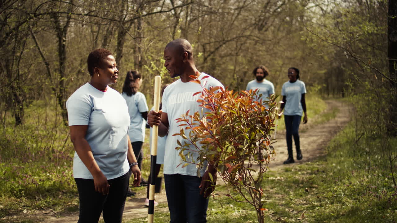 Portrait of african american couple fighting to preserve natural environment