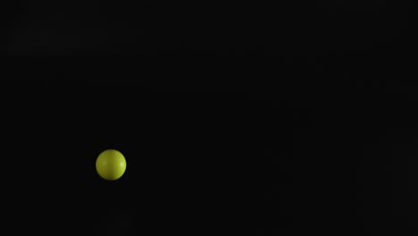 multiple colored balls bouncing in a dark space