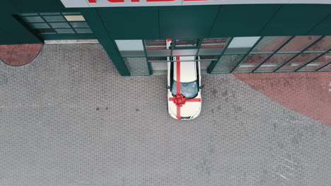 gift-wrapped car in parking lot