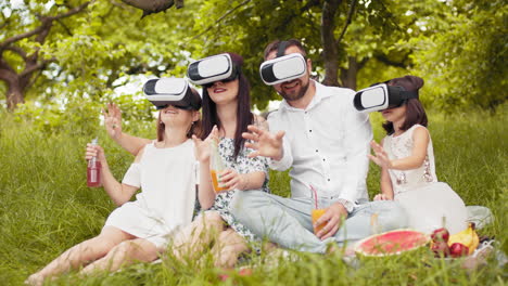 family enjoys a virtual reality picnic in the park