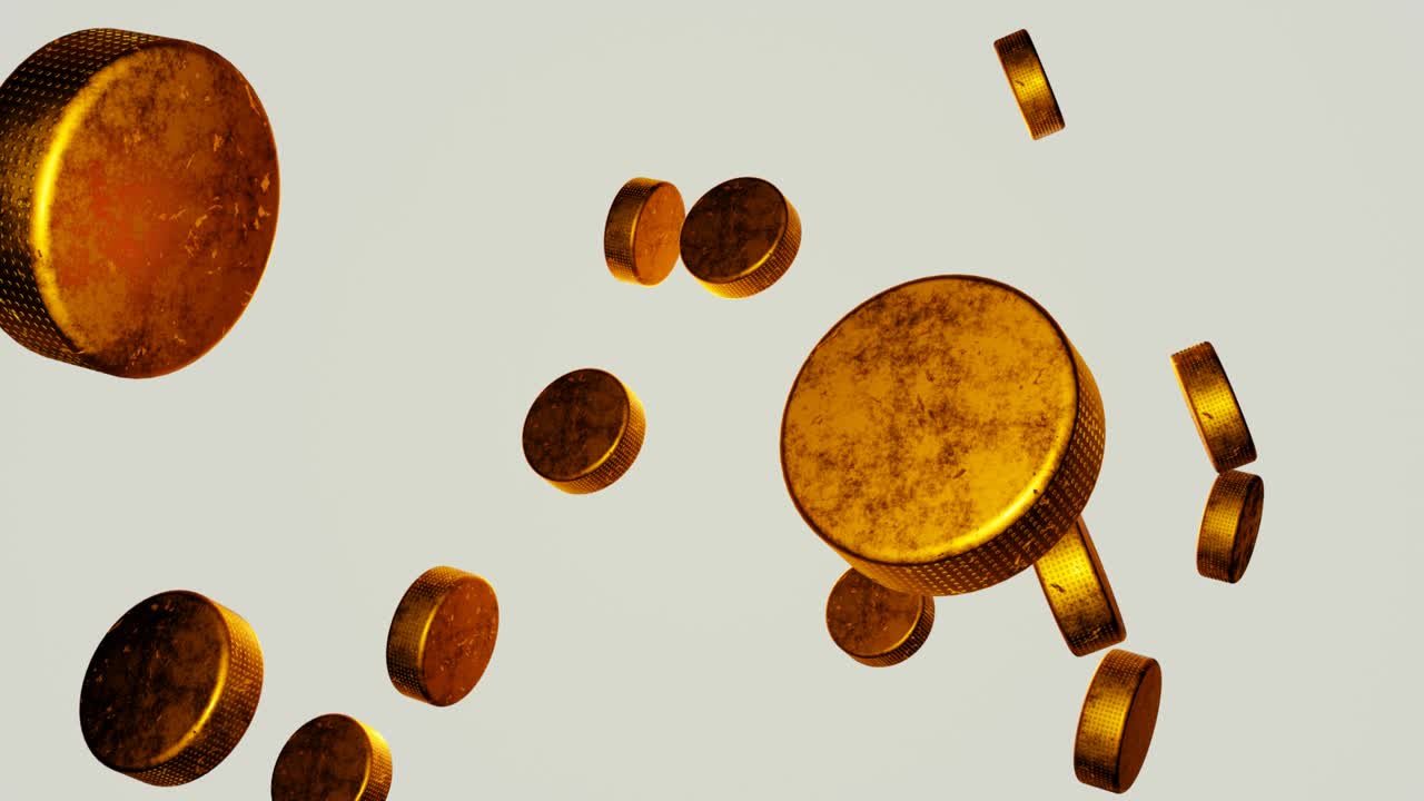 muchos disco de hockey dorados cayendo sobre un fondo blanco.