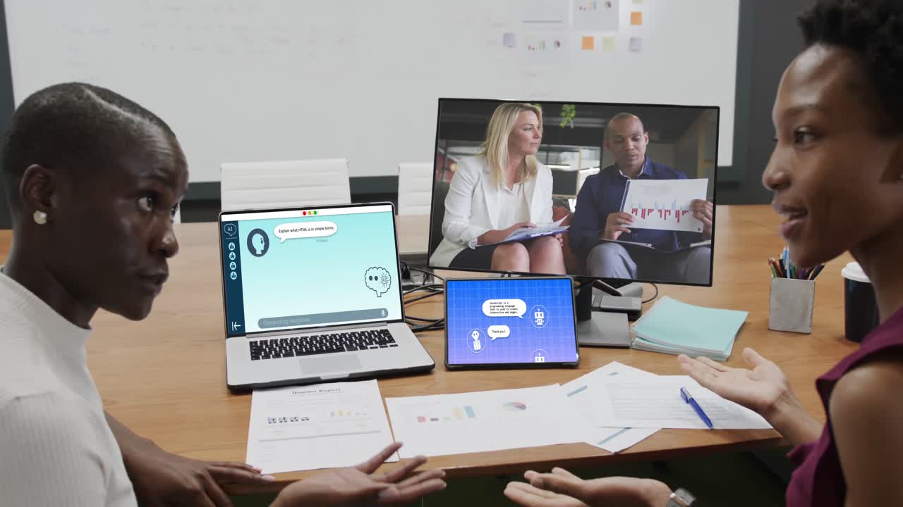 Diverse business people having video call and using laptop with digital chat on screen in office