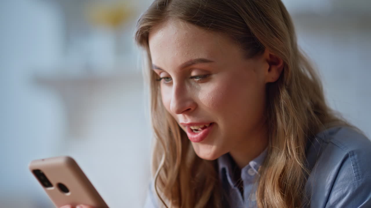 Housewife hands messaging cellphone in kitchen domestic weekend morning closeup