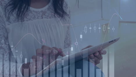 animation of statistical data processing over mid section of woman using digital tablet