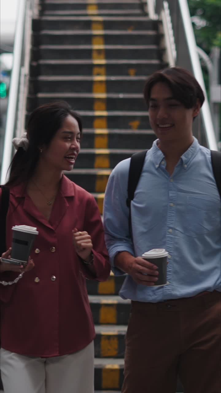 Couple walking on stairs in the city