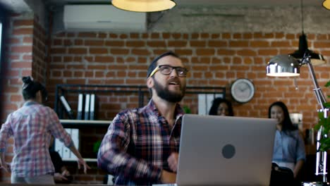 man receiving good news in office