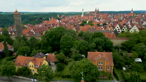 4k aerial drone video of the hohenner tower and sulfur tower on the walled city of rothenburg, germany