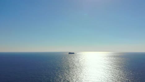 drone shot over the sea overlooking filfla island in the mediterranean sea