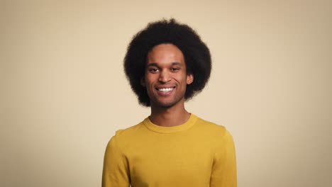 Portrait-of-happy-young-African-man-in-studio-shot