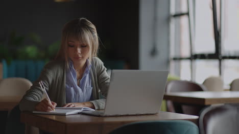 happiness attractive asian woman working with computer laptop thinking to get ideas and requirement in business startup at modern office or co-working spacebusiness startup concept