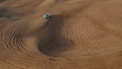 white suv in the desert dune