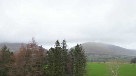 Pedestal-drone-shot-showing-the-panoramic-view-of-the-location-of-Castlerigg-Stone-Circle,-located-in-the-Lake-District-National-Park-in-North-West-England-in-United-KIngdom