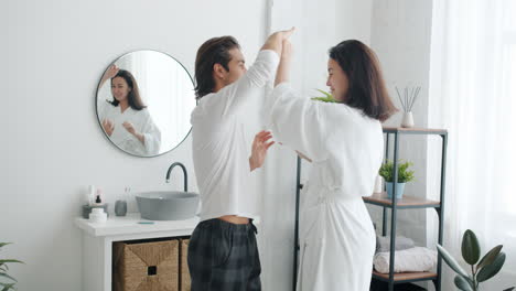 couple dancing in bathroom