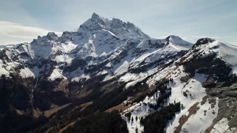 Panoramic-drone-shot-of-majestic-mountain-peaks,-4K