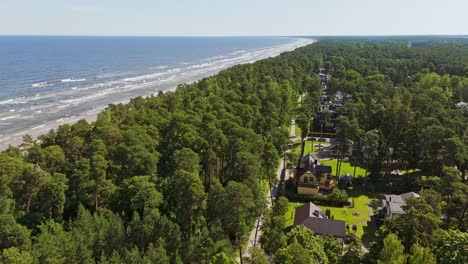 discover jurmala’s baltic shoreline where lush green forest meets sandy coast