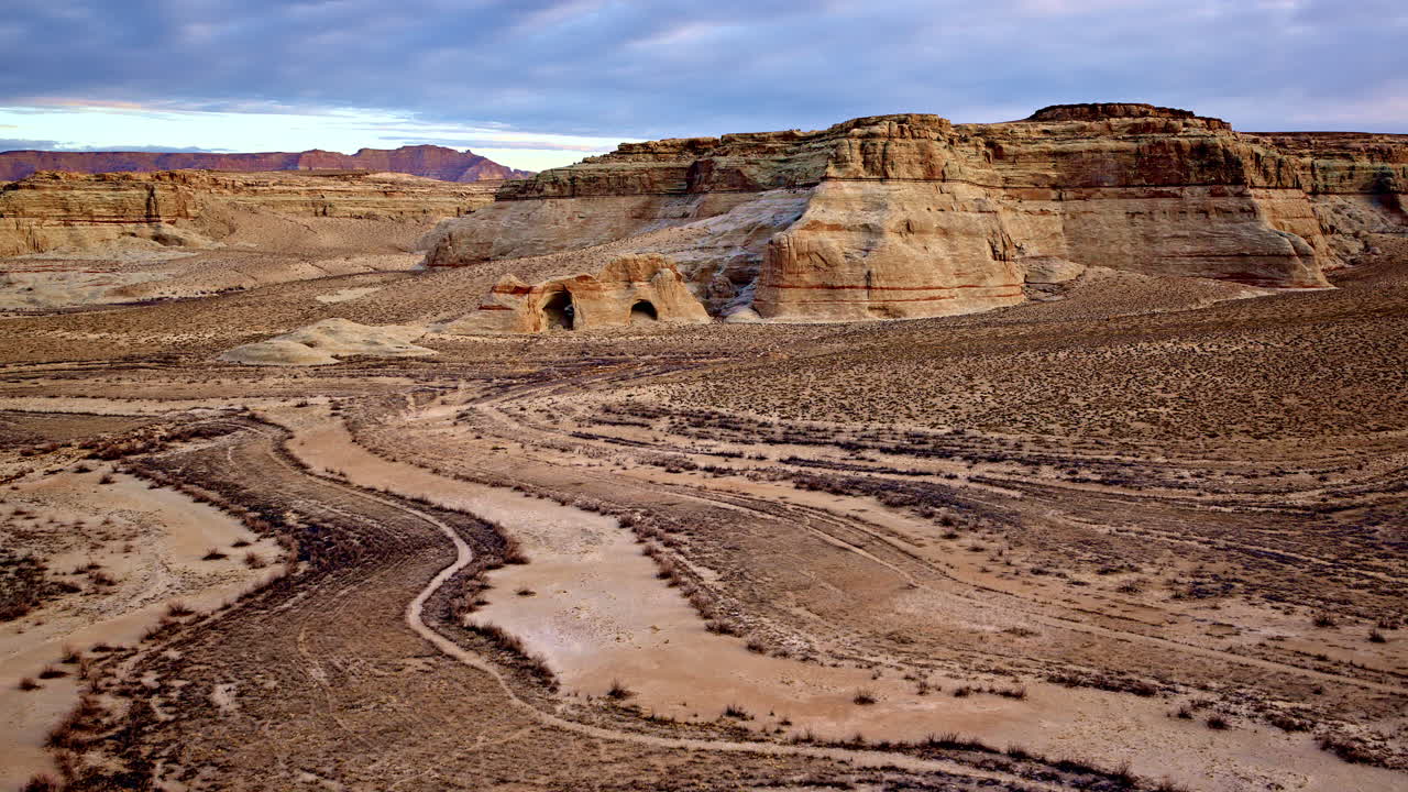 A breathtaking aerial shot capturing the contrast between the arid desert and vibrant red rock formations near Lake Powell.