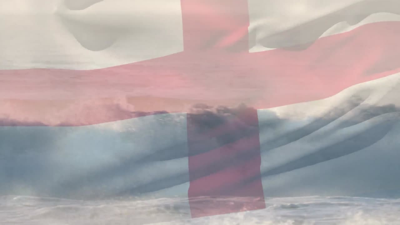 composición digital de agitar la bandera de inglaterra contra las olas en el mar