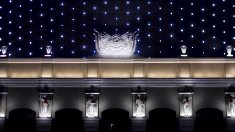 ornate building facade at night with festive lighting