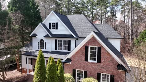 aerial panning up on the exterior of a luxury home