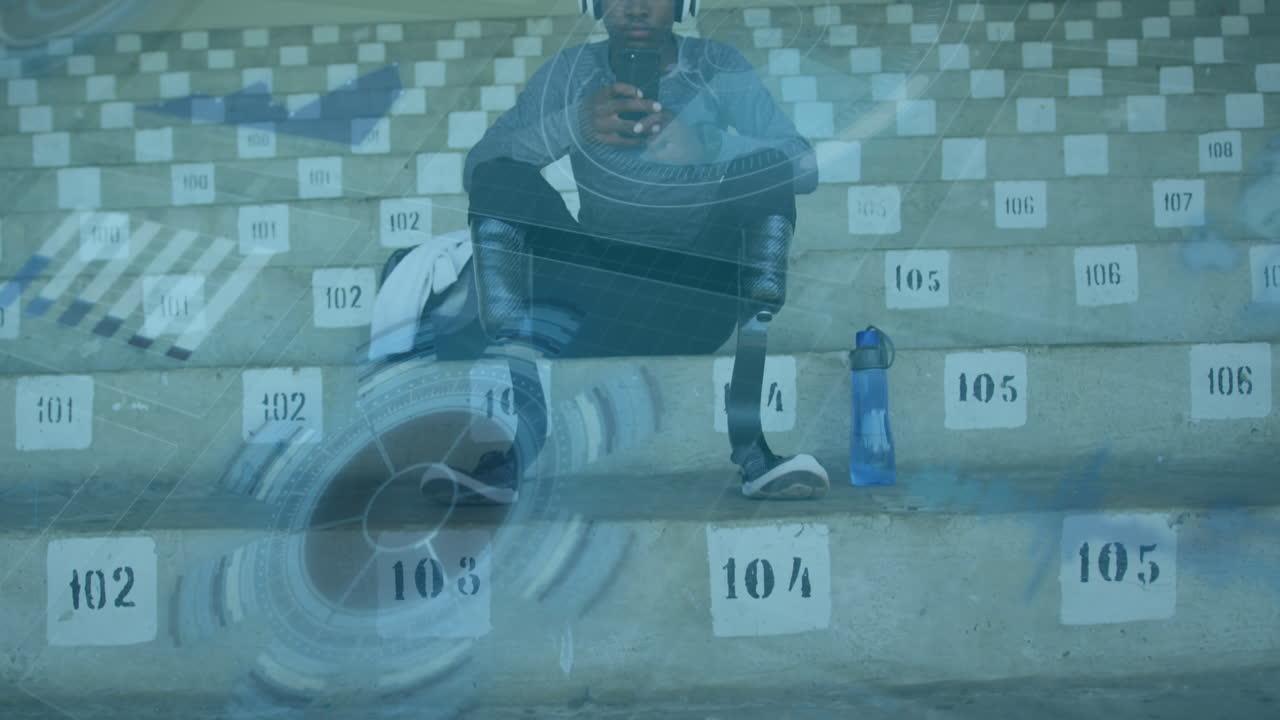 스포츠 스타디움의 관중석에서 장애인 남성 선수에 대한 디지털 데이터 처리 애니메이션