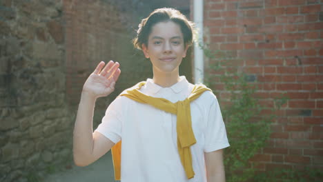 teenager waving