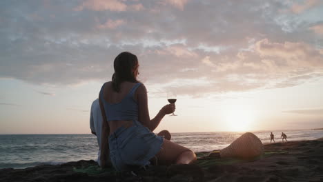 romantic picnic near ocean on sunset