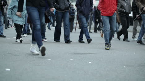 people legs walking in city