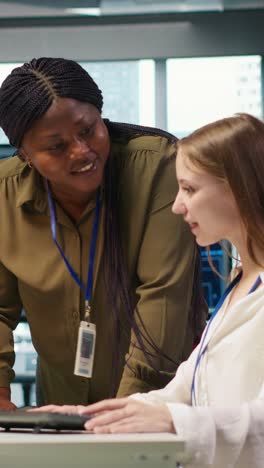 vertical video manager supervising young trainee in office using ai technology