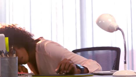 businesswoman sleeping while working in office