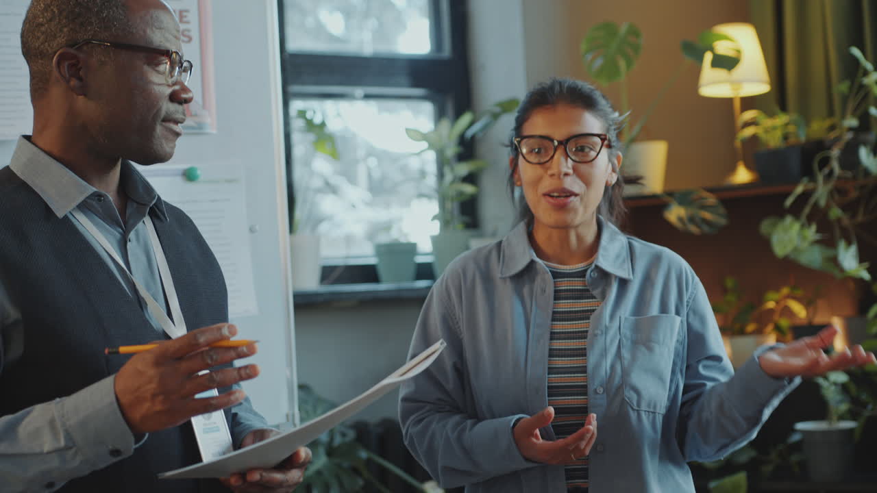 Hispanic Woman Answering Question of Teacher at Lesson in Immigrant School