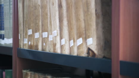 Old-books-and-manuscripts-on-a-wooden-shelf-in-the-library