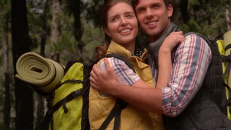 smiling couple on a hike in the countryside