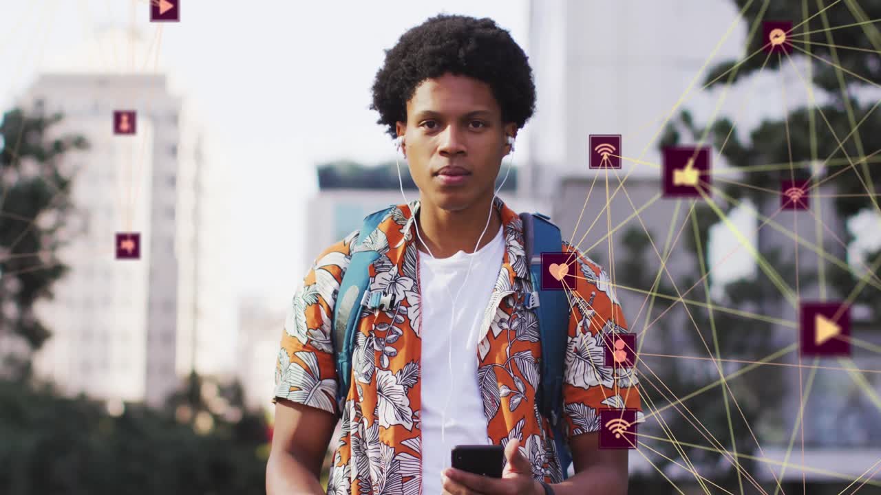 Animation of media icons over african american man using smartphone