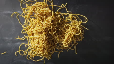 Dropping-spaghetti-on-the-table-in-slow-motion