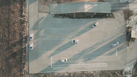 multiple automobiles practicing exercises on a driving lot for beginners. car driving school.