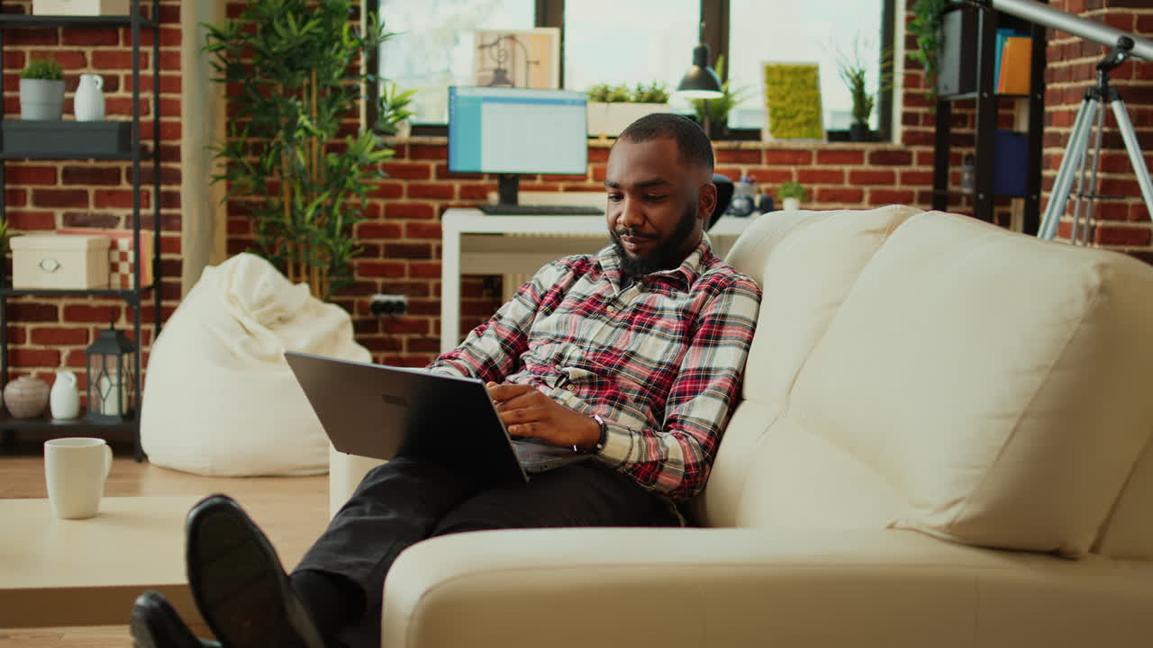Man working on laptop at home