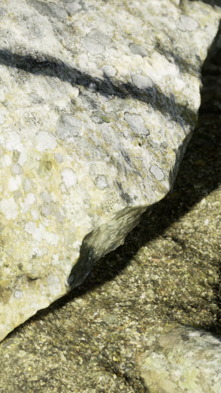 Exploring the textures and shadows of rugged rock formations in nature