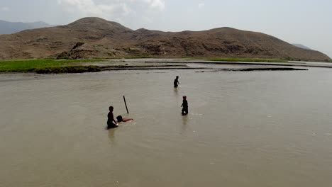 capturing sticks in the river flow