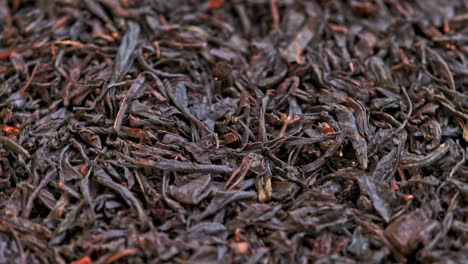 looped spinning dry black tea full frame close-up background