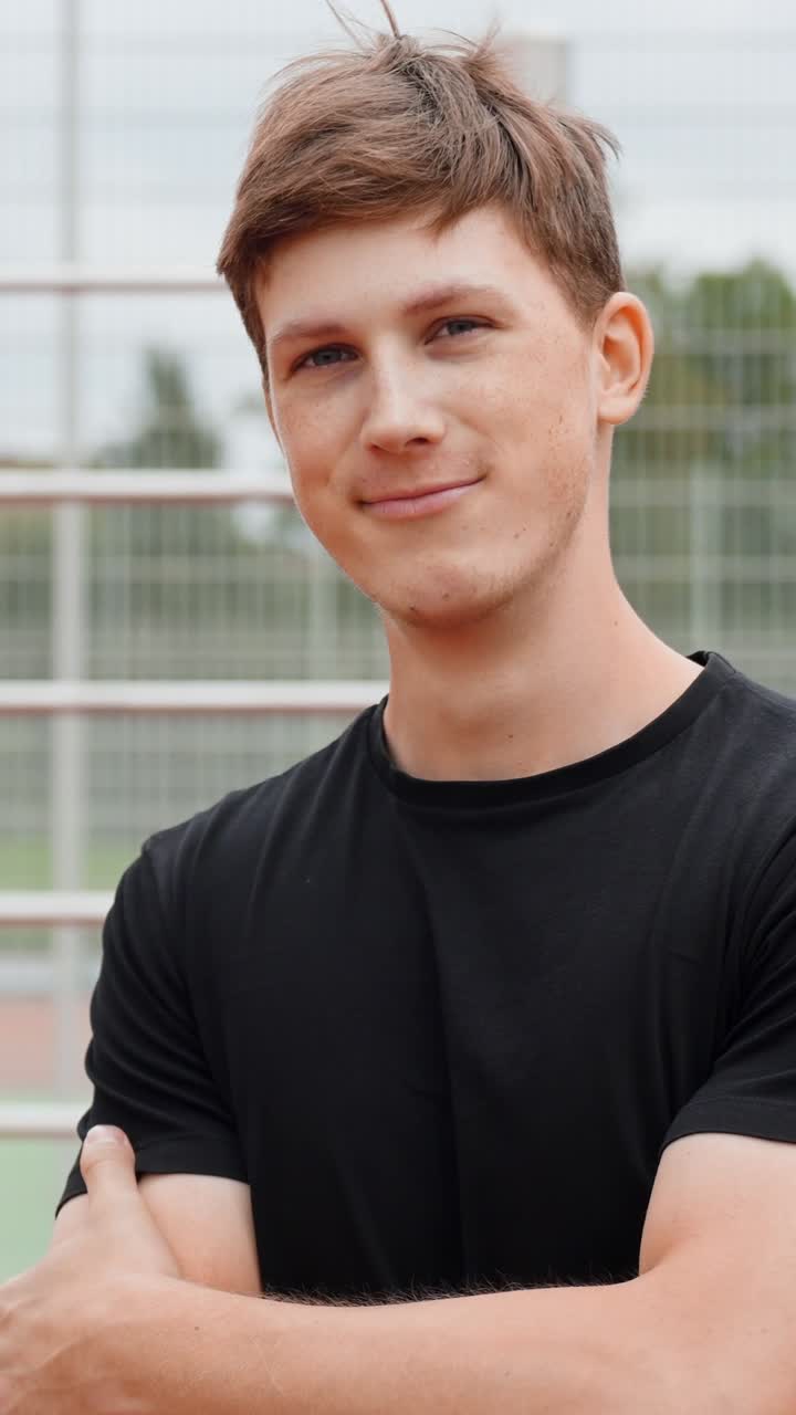 Caucasian Man Smiling At The Camera With Crossed Arms. - closeup shot