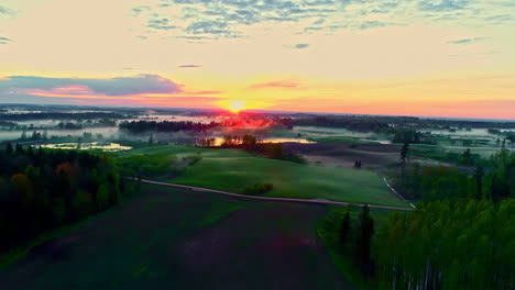 vibrant rural landscape during bright sunset or sunrise, aerial view