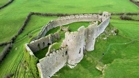 an aerial 4k rising shot of the spectacular norman castle roche remains high on a rocky outcrop in co louth nr dundalk ireland looking west