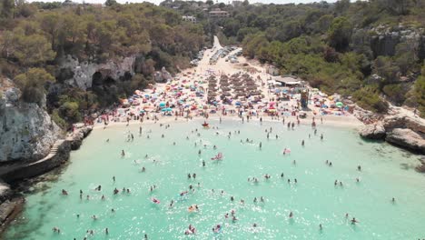 Spain-Mallorca-Cala-Llombards-and-Cala-Santanyi-at-4k-24fps-with-ND-filters-flying-with-a-DJI-Mavic-Air-with-beautiful-views-of-the-beaches,-rocks,-boats-and-blue-water